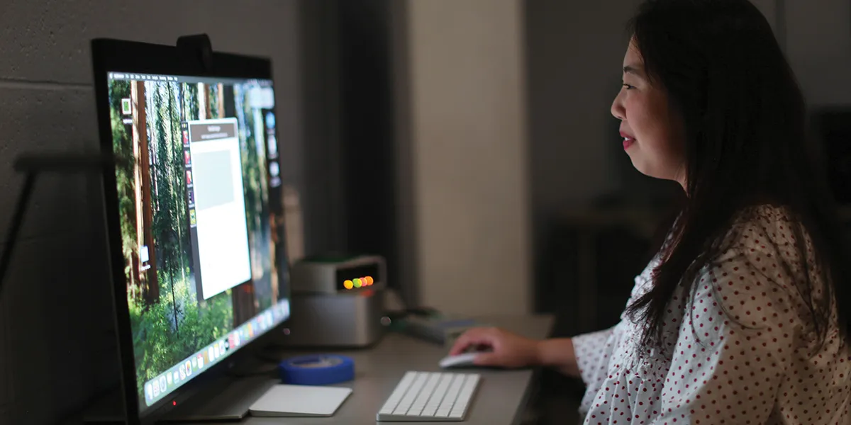 Photo of Abby Sypniewski looking at a computer screen