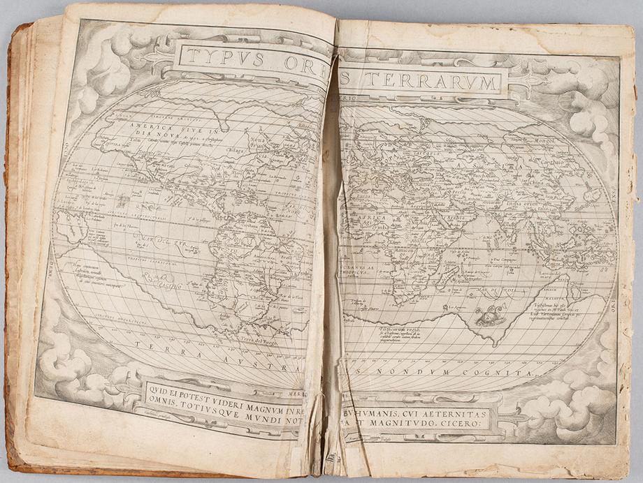 Open pages of the Ortelius Atlas showing a broken binding.