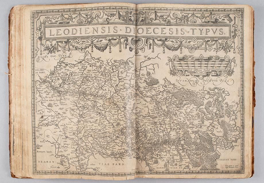 An open atlas with a map spanning across both pages.