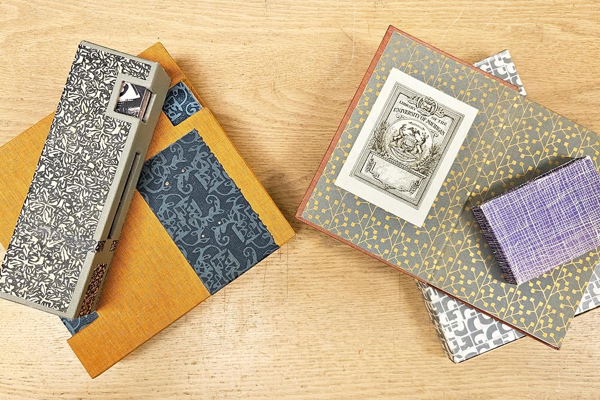Several books adorned with decorative paper.